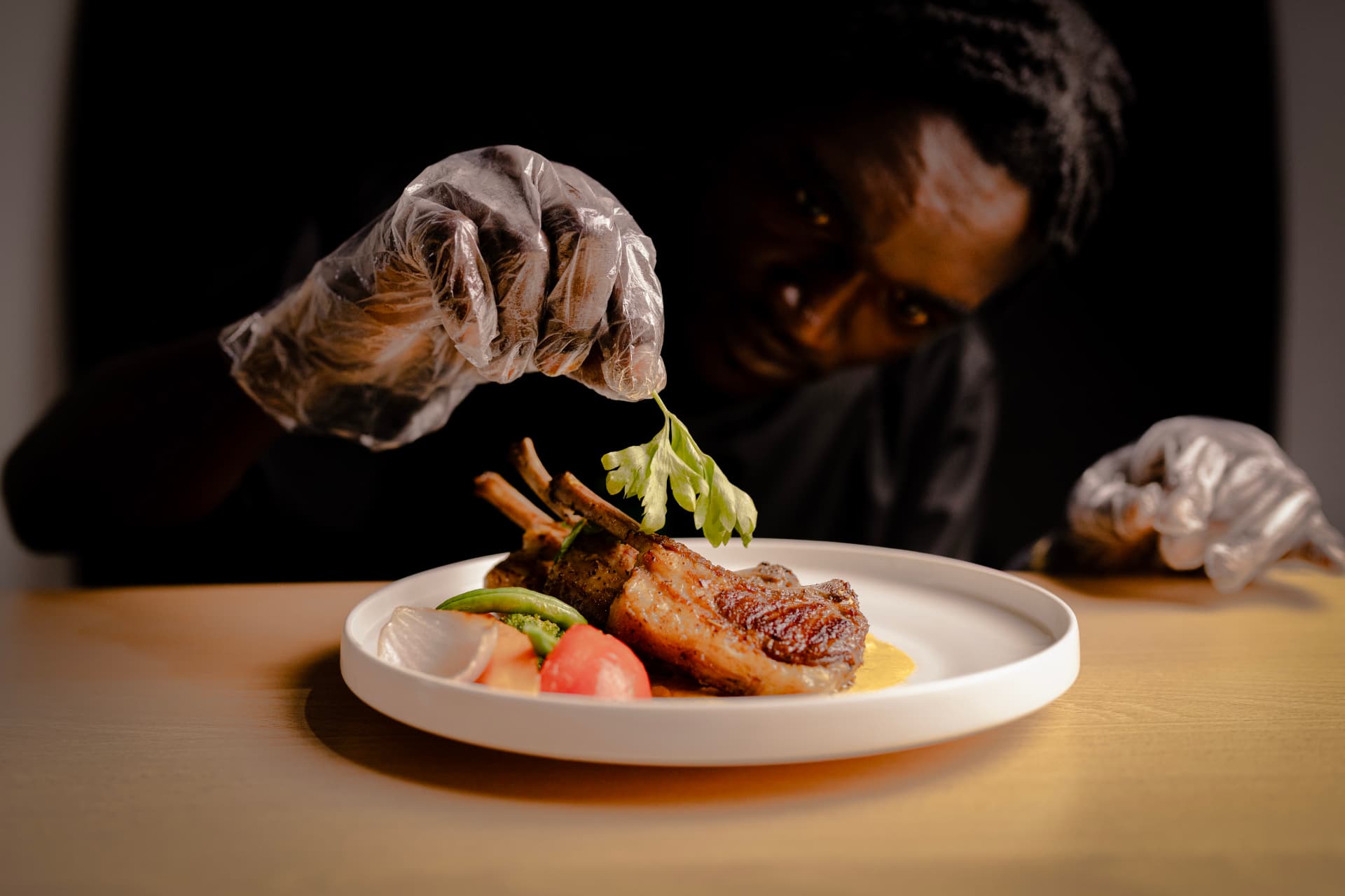 Executive chef plating a dish at Lime Restaurant & Bar